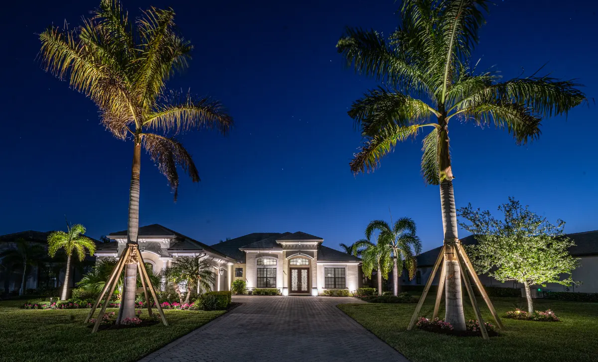 Naples estate at night with layered landscape and architectural lighting by Spectrum Nightscapes